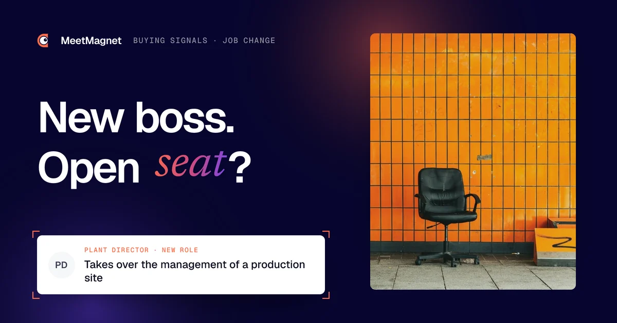 Empty office chair against an orange wall